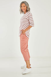Model Luisa wearing size 10 of the Agatha Jeans in colour Coral (Pink), from the front, showing the whole outfit