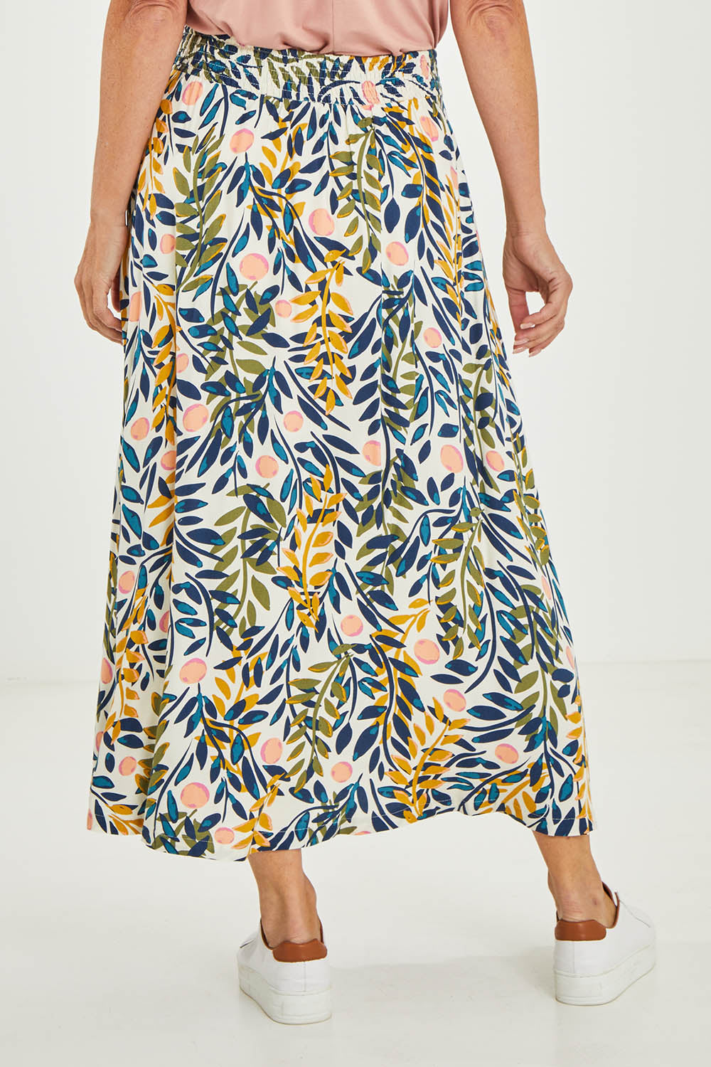 Model Luisa wearing size 10 of the Trailing Maxi Skirt in colour Multi (White), from the back