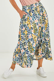 Model Luisa wearing size 10 of the Trailing Maxi Skirt in colour Multi (White), from the front, cropped image