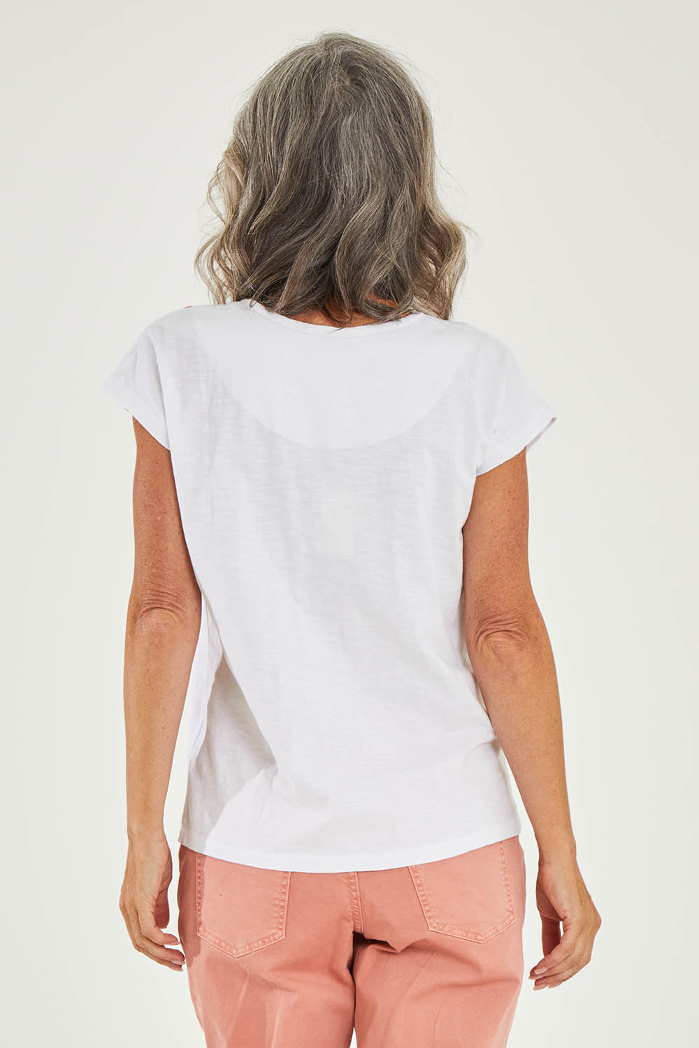 Model Luisa wearing size 10 of the Frida Tshirt in colour White (White), from the back