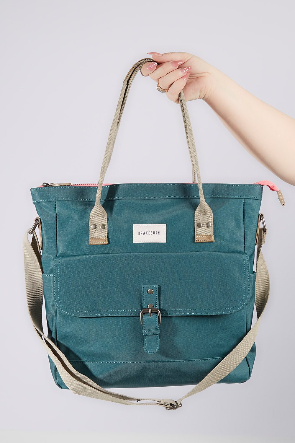 A model wearing size OneSize of the Sage Shopper in colour Sage (Blue), from the front, showing the whole outfit