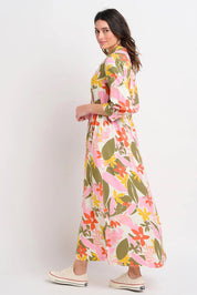 A model wearing the Tropical Palm Shirt Dress in colour Multi (Pink), from the back