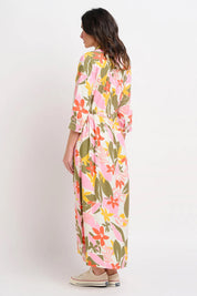 A model wearing the Tropical Palm Shirt Dress in colour Multi (Pink), from the back