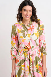 A model wearing the Tropical Palm Shirt Dress in colour Multi (Pink), from the front, cropped image