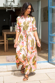 A model wearing the Tropical Palm Shirt Dress in colour Multi (Pink), from the front, showing the whole outfit