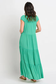 A model wearing the Wynn Maxi Dress in colour Green (Green), from the back