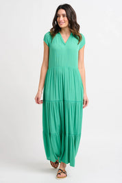 A model wearing the Wynn Maxi Dress in colour Green (Green), from the front, showing the whole outfit