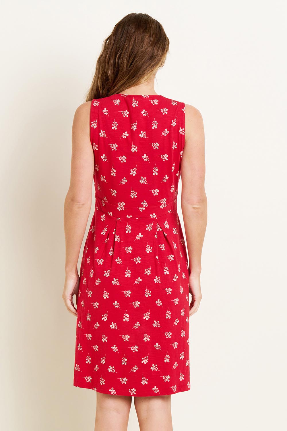 A model wearing the Marine Sleeveless Dress in colour Red (Red), from the back