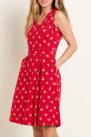 A model wearing the Marine Sleeveless Dress in colour Red (Red), from the front, cropped image