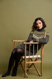A model wearing the Roll Neck Knitted Dress in colour Grey (Grey), from the front, showing the whole outfit