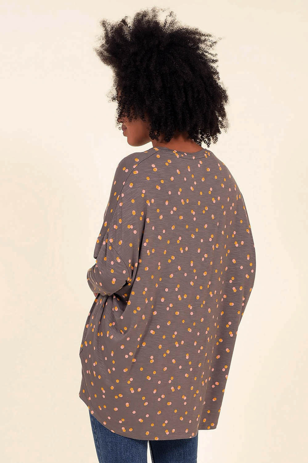 A model wearing the Dotty Loose Fit L/S Top in colour Navy (Blue), from the back