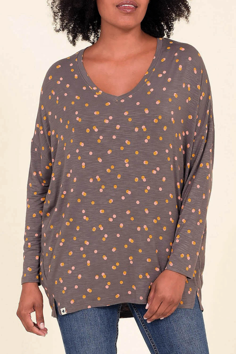 A model wearing the Dotty Loose Fit L/S Top in colour Navy (Blue), from the front, cropped image