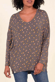A model wearing the Dotty Loose Fit L/S Top in colour Navy (Blue), from the front, cropped image