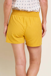 A model wearing the Mustard Elasticated Waist Short in colour Yellow, from the back