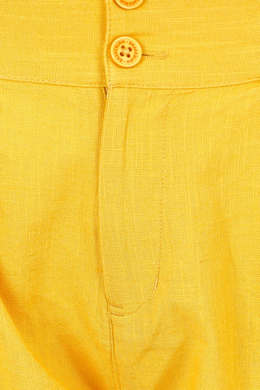 Product shot of the Mustard Elasticated Waist Short in colour Yellow, detail