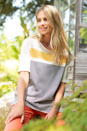 A model wearing the Beach Stripe Tee in colour Multi (Blue), from the front, showing the whole outfit