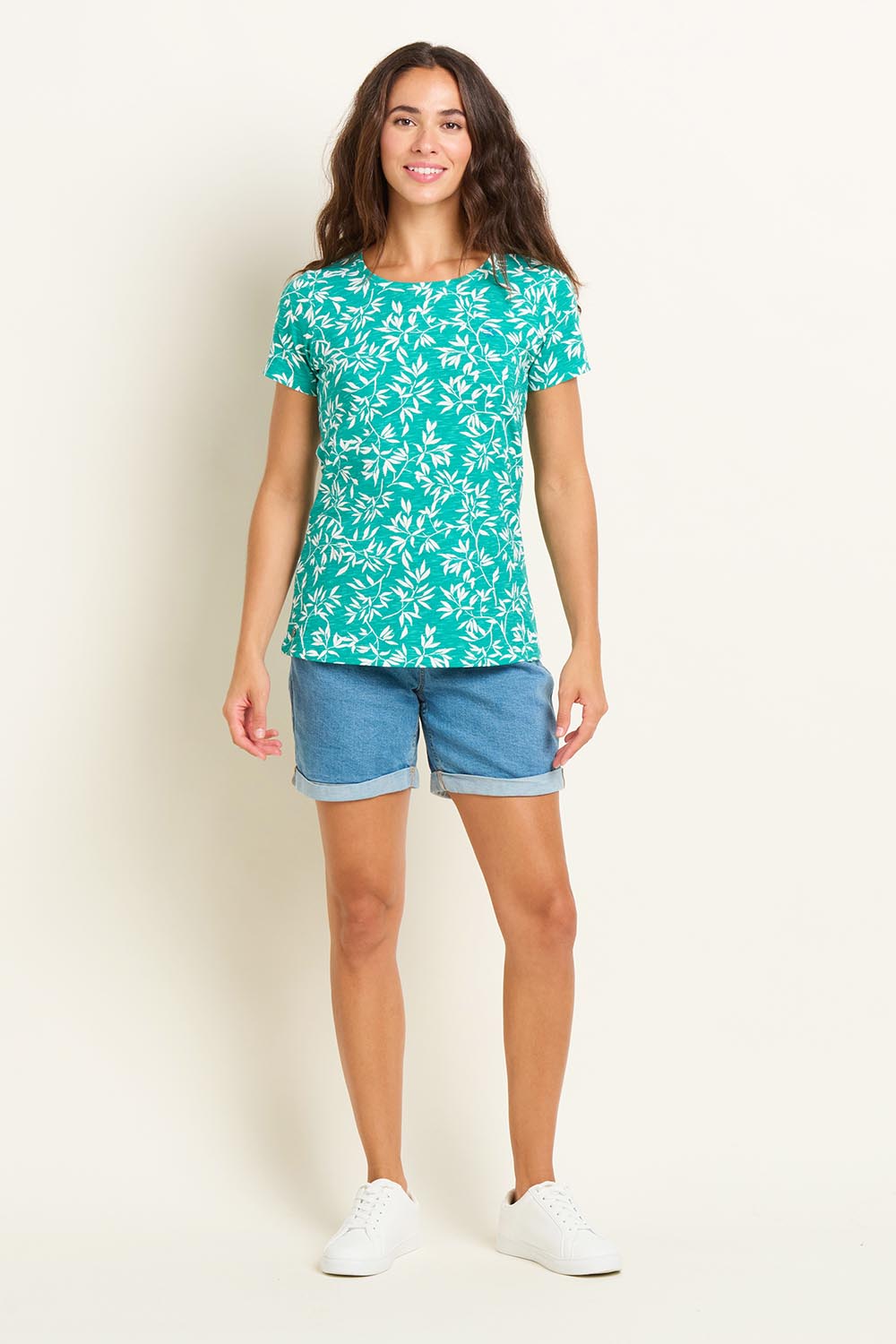 A model wearing the Bamboo Leaves Tshirt in colour Green (Green), from the front, showing the whole outfit