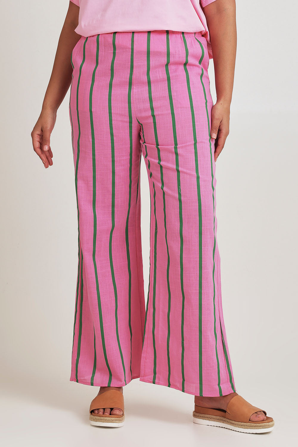 Model Terri-Leigh wearing size L of the Pasta Lovers Club Pants in colour Pink (Pink), from the front, cropped image