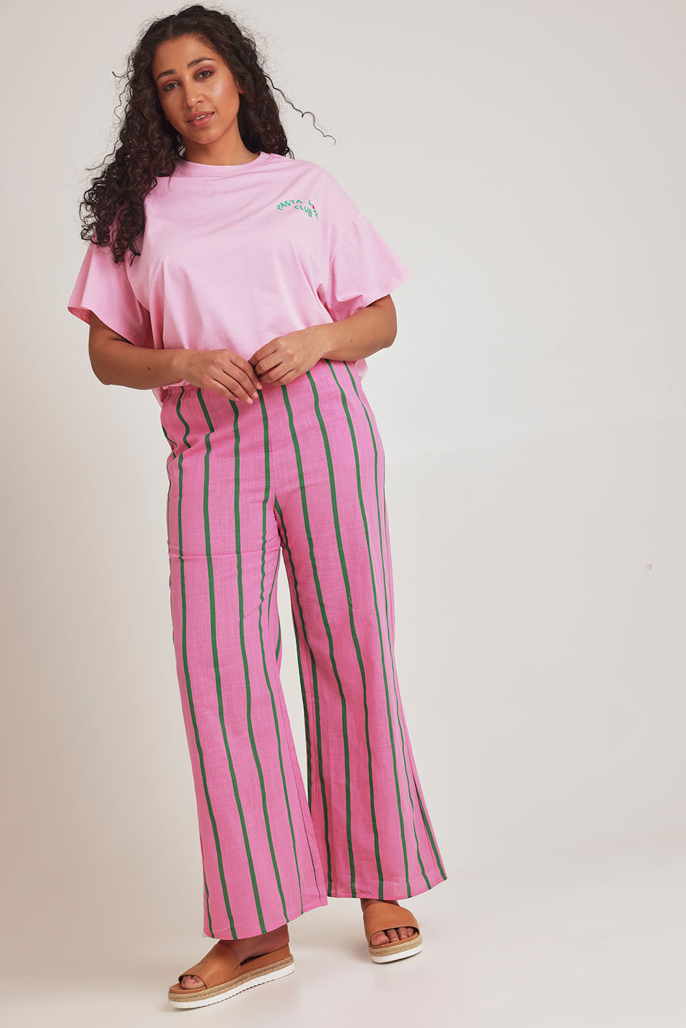Model Terri-Leigh wearing size L of the Pasta Lovers Club Pants in colour Pink (Pink), from the front, showing the whole outfit