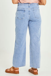 Model Terri-Leigh wearing size 14 of the Taylor Straight Jean in colour Midblue (Blue), from the back