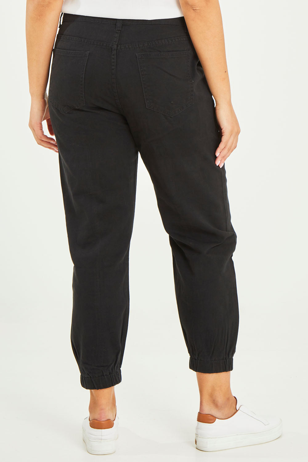 Model Terri-Leigh wearing size 14 of the Sara Cuffed Jean in colour Black (Black), from the back