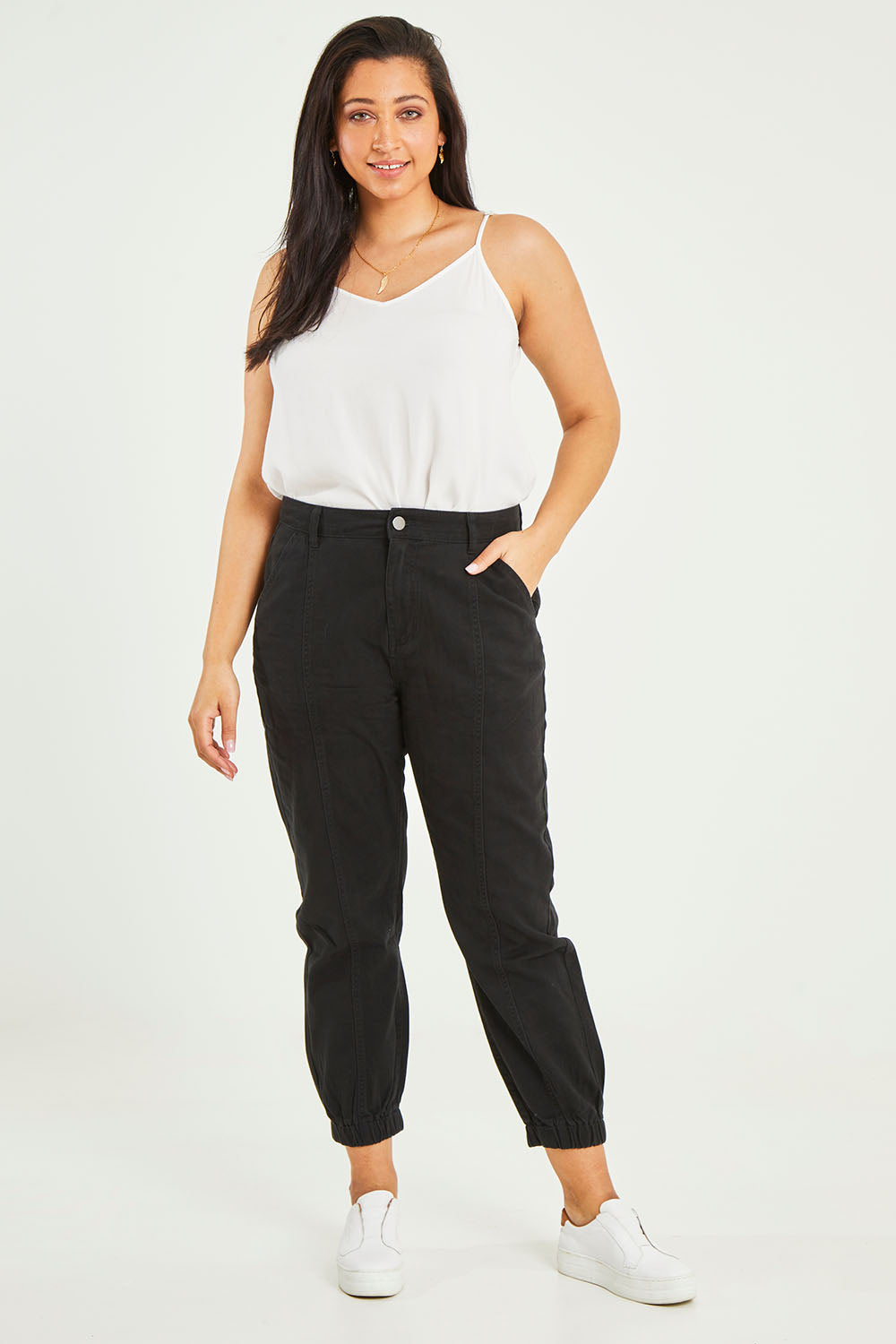 Model Terri-Leigh wearing size 14 of the Sara Cuffed Jean in colour Black (Black), from the front, showing the whole outfit