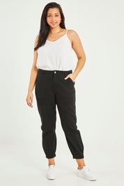 Model Terri-Leigh wearing size 14 of the Sara Cuffed Jean in colour Black (Black), from the front, showing the whole outfit