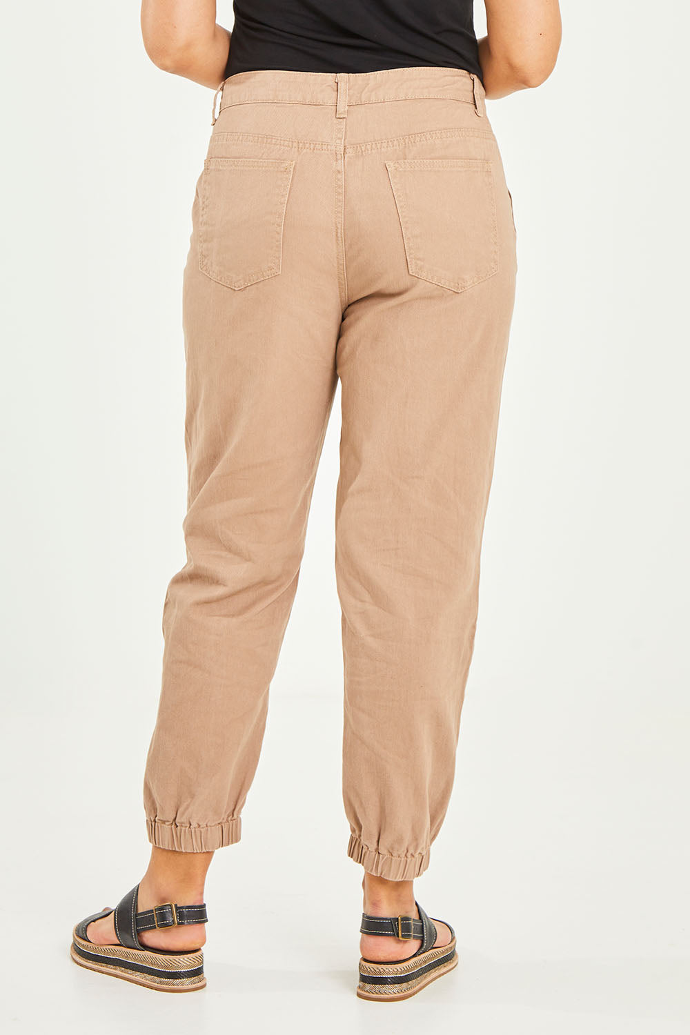Model Terri-Leigh wearing size 14 of the Sara Cuffed Jean in colour Cream, from the back