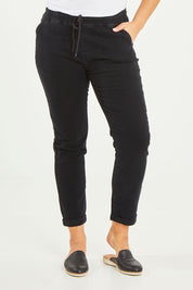 Model Terri-Leigh wearing size 14 of the Angela Jogger Jean in colour Black (Black), from the front, cropped image
