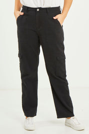 Model Terri-Leigh wearing size 14 of the Amanda Straight Jean in colour Black (Black), from the front, cropped image