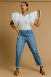 Model Noli wearing size 14 of the Elle Straight Jean in colour Midblue (Blue), from the front, showing the whole outfit