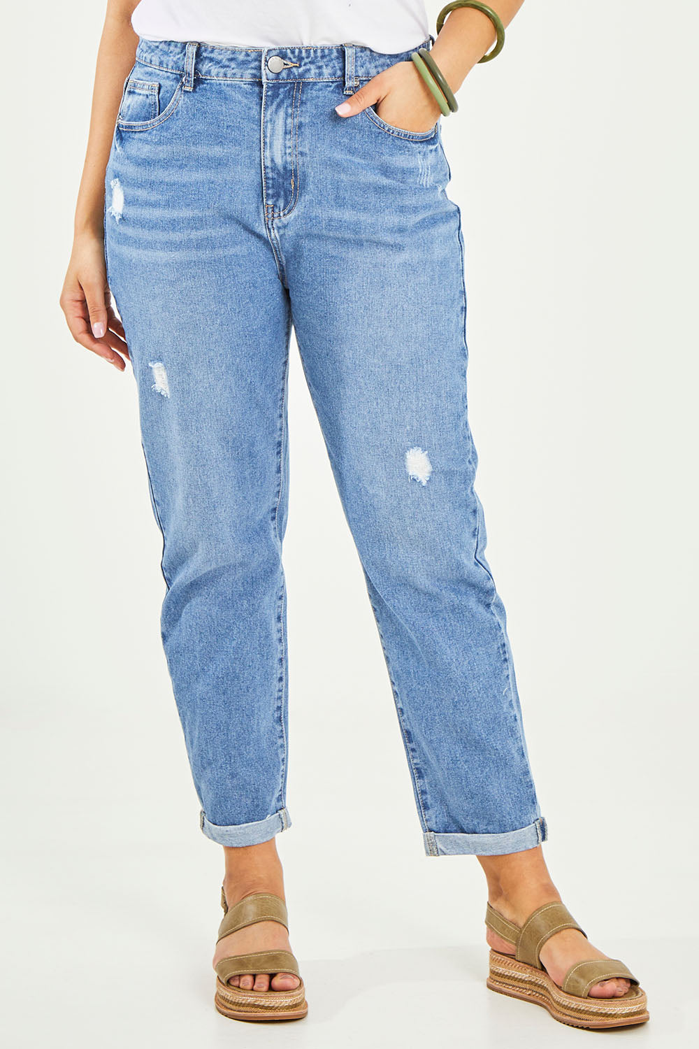 Model Terri-Leigh wearing size 14 of the Elle Straight Jean in colour Midblue (Blue), from the front, cropped image