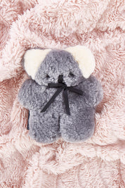 A model wearing the Baby Flatout Bear in colour Koala (Blue), from the front, showing the whole outfit