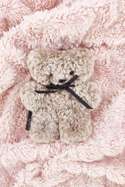A model wearing the Baby Flatout Bear in colour Latte, from the front, showing the whole outfit