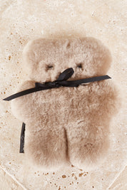 A model wearing the Baby Flatout Bear in colour Latte, from the front, showing the whole outfit