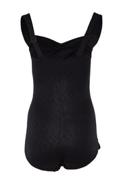 Product shot of the Classique Retro Skirted One Piece in colour Black (Black), from the back