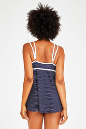 Model Olivia wearing size 12 of the Underwire Swim Dress in colour NavyWhite (Blue), from the back