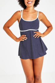 Model Olivia wearing size 12 of the Underwire Swim Dress in colour NavyWhite (Blue), from the front, cropped image