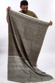 A model wearing size OneSize of the Handwoven Abay Beach Towel in colour Lightgrey (Grey), from the front, showing the whole outfit