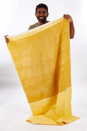 A model wearing size OneSize of the Handwoven Abay Beach Towel in colour Sunflower, from the front, showing the whole outfit