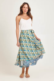 Model Madeline wearing the Dalah Silk Blend Wrap Skirt in colour Dalah (Blue), from the front, showing the whole outfit