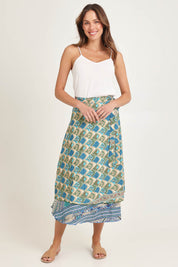 Model Madeline wearing the Dalah Silk Blend Wrap Skirt in colour Dalah (Blue), from the front, showing the whole outfit