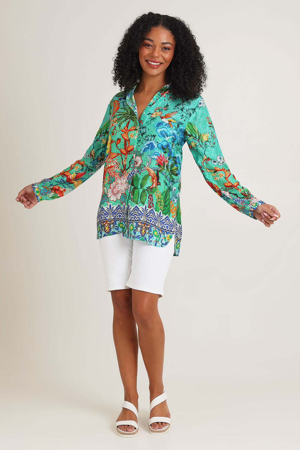 Model Ziara wearing size S of the Tea House Shirt in colour Teahouse (Green), from the front, showing the whole outfit