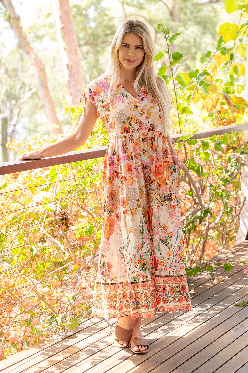 A model wearing the Rouge Bloom Bluebell Cotton Dress in colour Rouge, from the front, showing the whole outfit