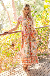 A model wearing the Rouge Bloom Bluebell Cotton Dress in colour Rouge, from the front, showing the whole outfit