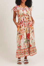 Model Ziara wearing size S of the Rouge Bloom Bluebell Cotton Dress in colour Rouge, from the front, cropped image