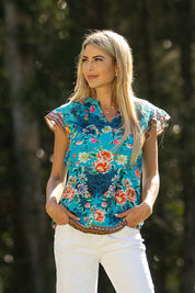 A model wearing the Lotus Garden Sarah Cotton Top in colour Lotus (Blue), from the front, showing the whole outfit