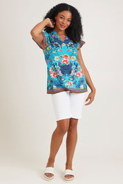 Model Ziara wearing size S of the Lotus Garden Sarah Cotton Top in colour Lotus (Blue), from the front, showing the whole outfit