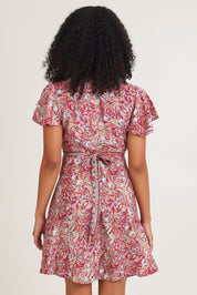Model Ziara wearing size S of the Cleo Silk Blend Wrap Dress in colour Cleo (Pink), from the back