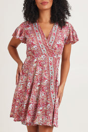 Model Ziara wearing size S of the Cleo Silk Blend Wrap Dress in colour Cleo (Pink), from the front, cropped image